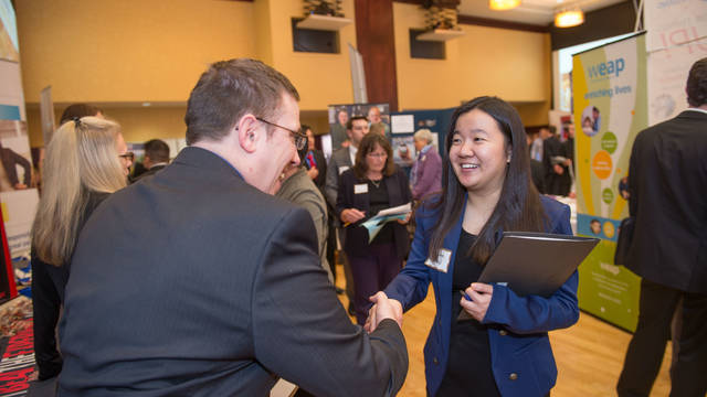 Student shaking hands at Career fair
