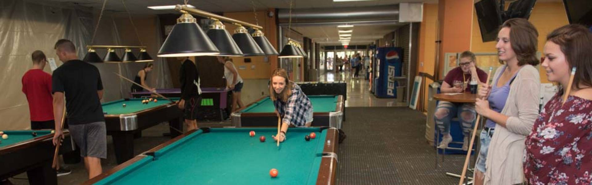 Students playing pool in the Hilltop Billiards Center