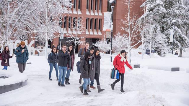 Students walk to class in the snow