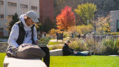 UW-Eau Claire students study and relax on lower campus on a warm fall day.