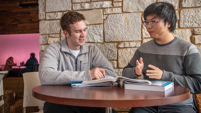 Noah Turecek (left) and Mingyang Qu meet to catch up on classes and life, but also to help each other build their language skills and their understanding of cultures that differ from their own.