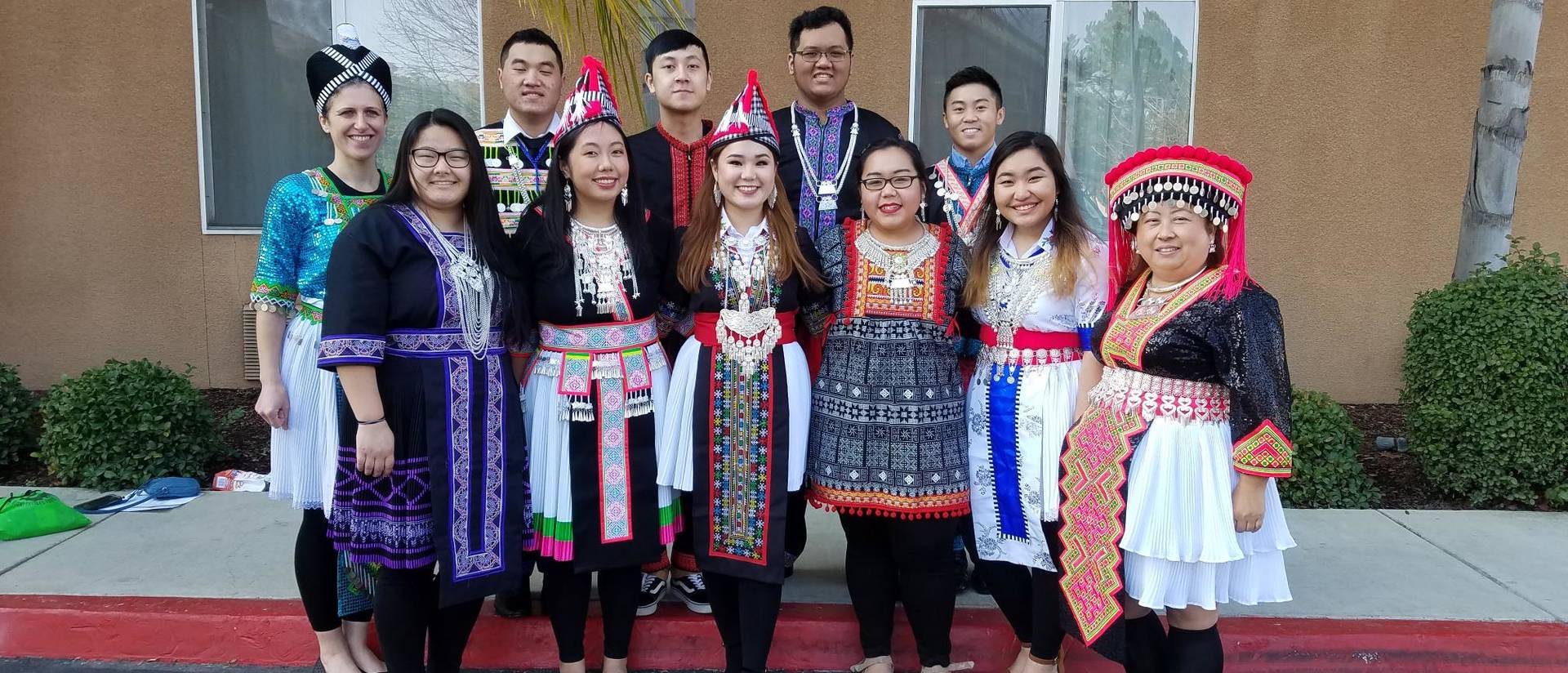 Students and faculty in traditional Hmong dress