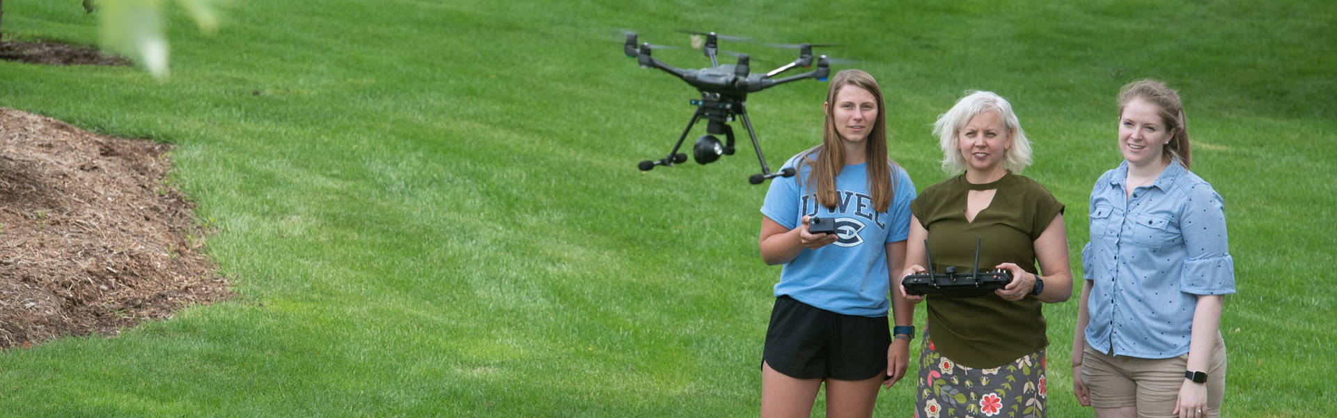 Dr. Patricia Cleary and students with drone
