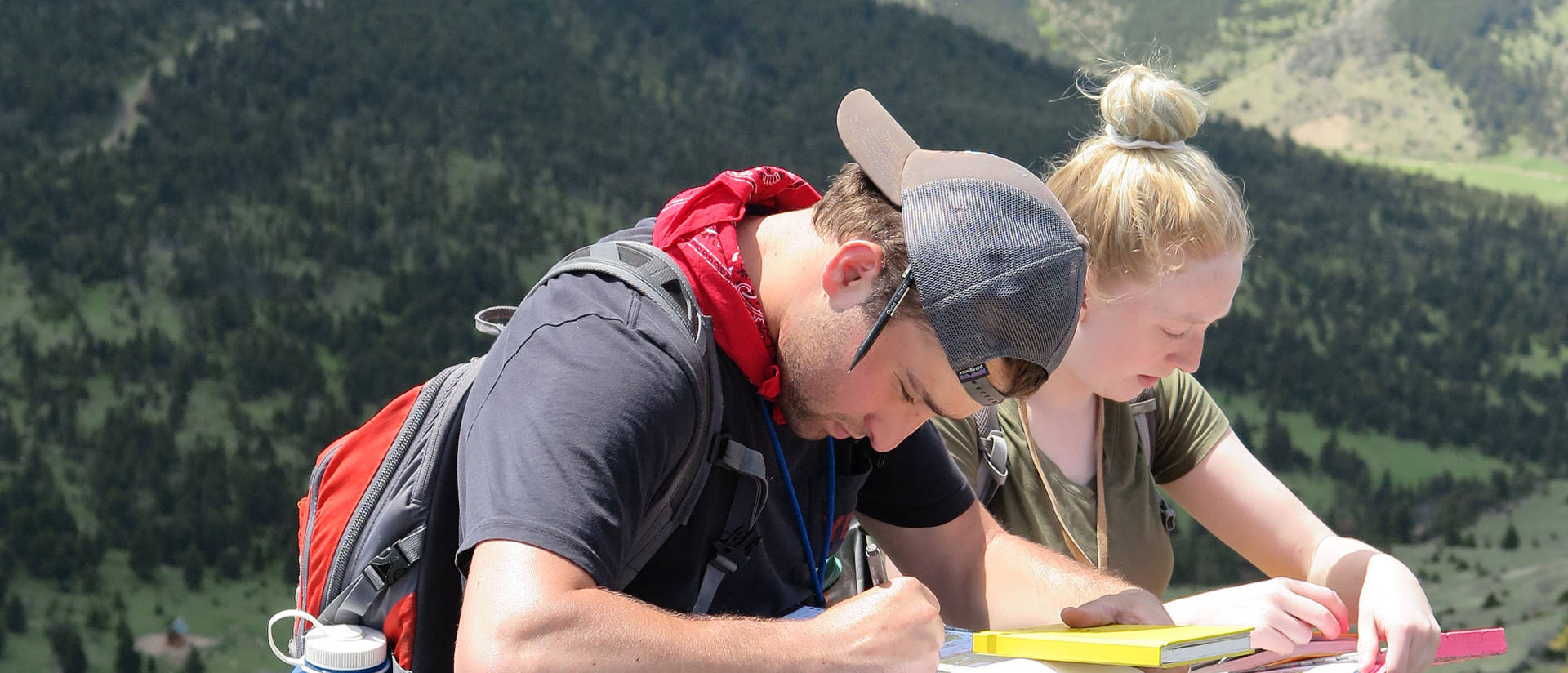 Dig It geology newsleter cover photo, students in mountain scene