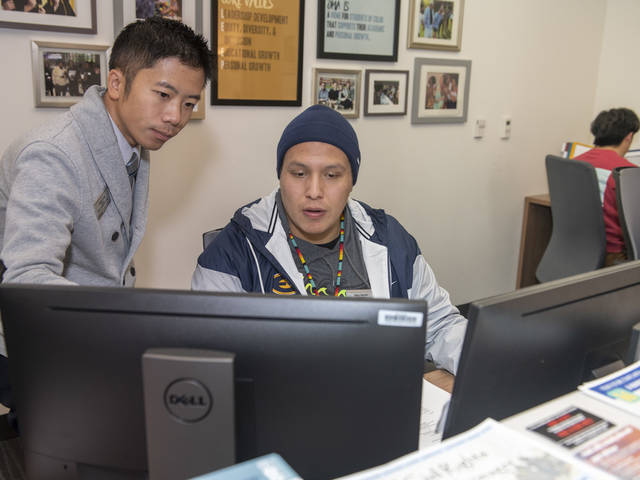 Dang and Yang and Gary Garvin at fron desk of OMA office