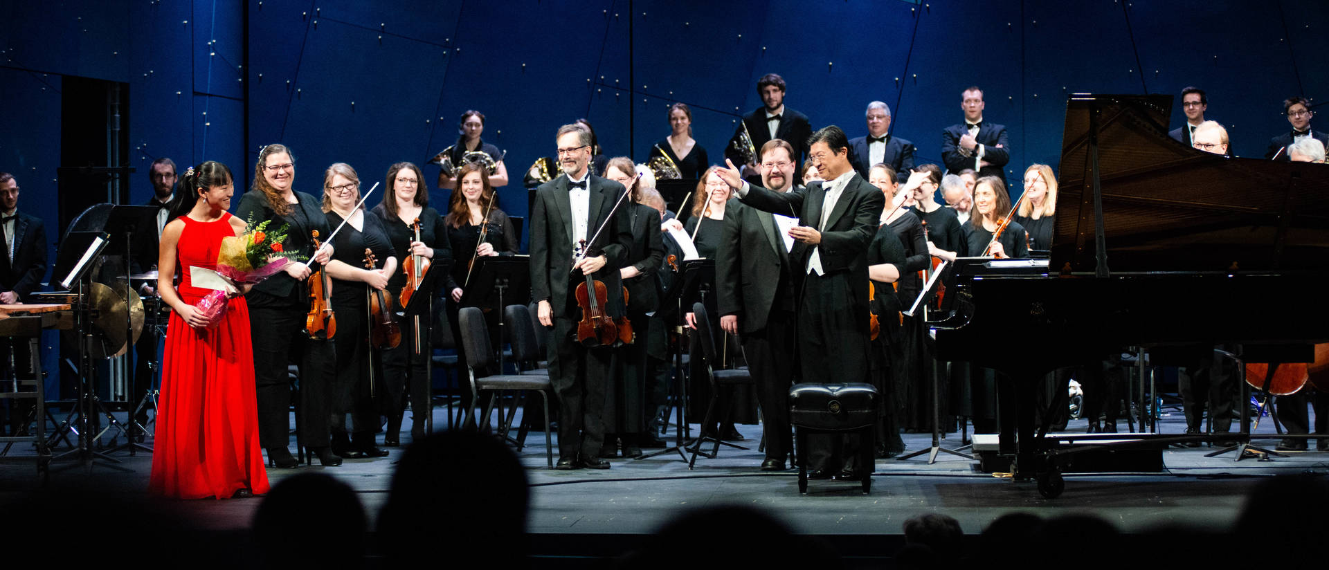 Nobuyoshi Yasuda, pictured with the Chippewa Valley Symphony and soloist Jessica Jiang earlier this month, has been selected to lead the 2020 All-National Symphony Orchestra next November in Orlando, Florida. (Photo credit: Mark Oliver)