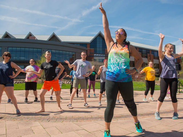 Students doing Zumba on lower campus mall