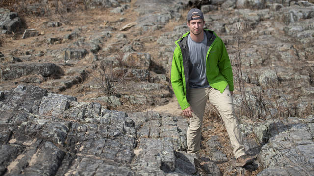 Trevor Nelson hiking among rocks