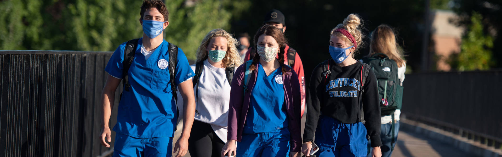 Nursing students walking across bridge during pandemic