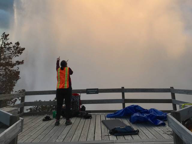 Blugold Mara Reed looks at the famous Steamboat Geyser as it begins a major eruption. (Photo by Xiaojing Ruby Fu)