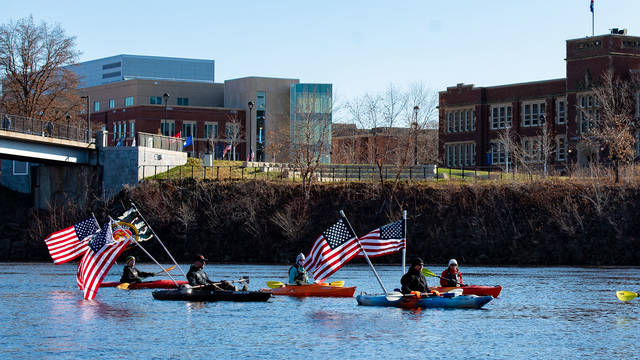 Boats with American flags on Chippewa River