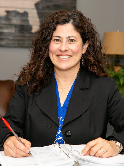 Olga Diaz at desk