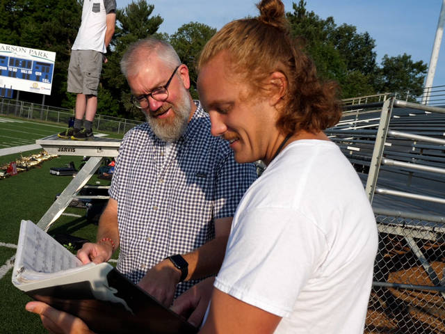 Music professor Dr. Jeff Crowell (left) collaborated with Andrew Smits, a music education major who plays in the Blugold Marching Band, on a summer research project, “Blugold Marching Band Formation Research Project.”