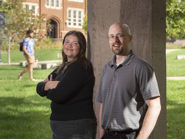 Dr. Eric Kasper teaches political science at UW-Eau Claire, his alma mater. This fall, his daughter, Maddie, joined him on campus and began working toward her own degree in political science. (Photo by Bill Hoepner)