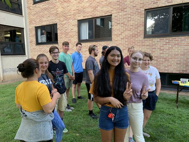 A group of LLC students meet outside Bridgman Hall
