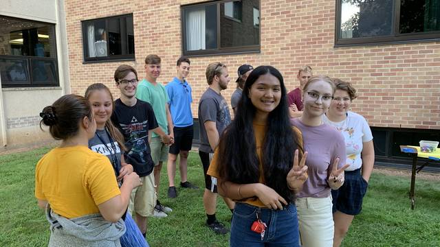 A group of LLC students meet outside Bridgman Hall