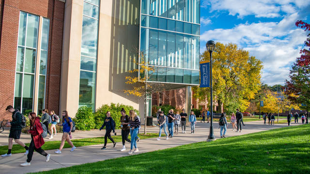 Photo of students walking in front of Centennial Hall