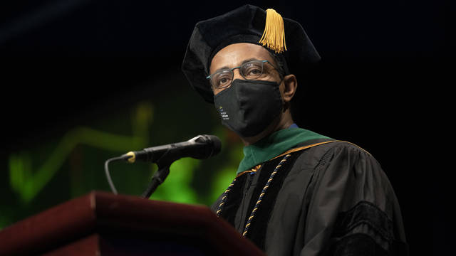 During his “Charge to the Class,” Dr. Woubeshet Ayenew, a 1992 graduate and respected Minneapolis cardiologist, challenged UW-Eau Claire’s newest graduates to find a career that “ignites your core and brings you alive.” (Photo by Shane Opatz)
