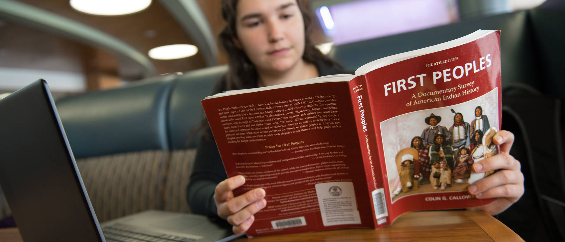 Student reading a textbook