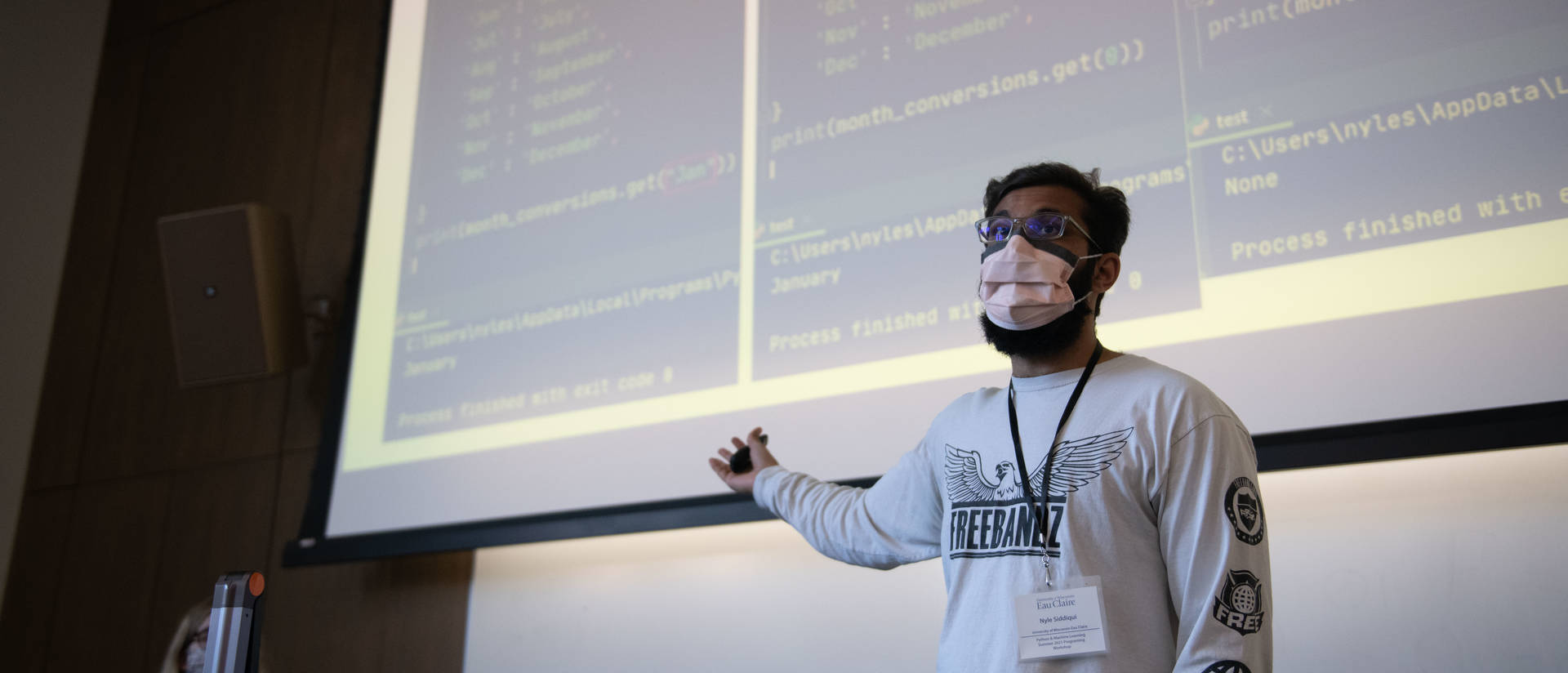 Software engineering student presenting at a computer programming camp