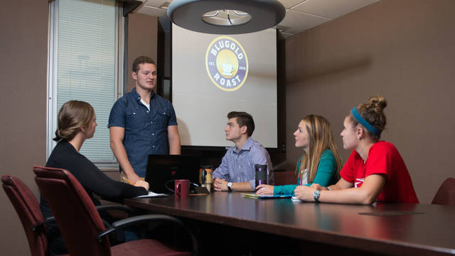Students discuss Blugold Roast, an LLC that began at UWEC