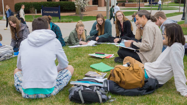 Students enjoying a language class outside