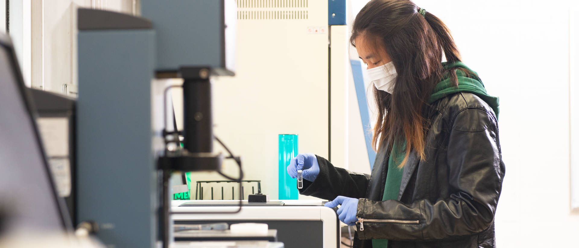 A materials science student works on a capstone project in the lab.