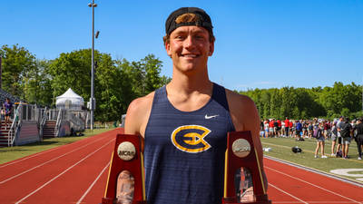Blugold Marcus Weaver displays the trophies from his individual national championships in both the javelin and decathlon.