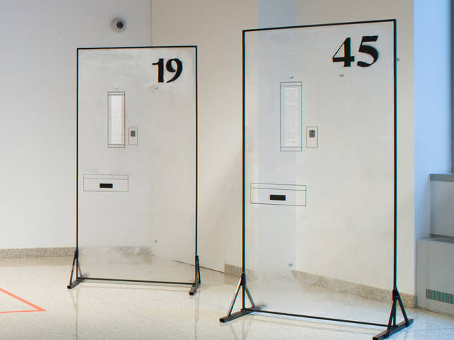 Two freestanding sculptures replicating prison cell doors