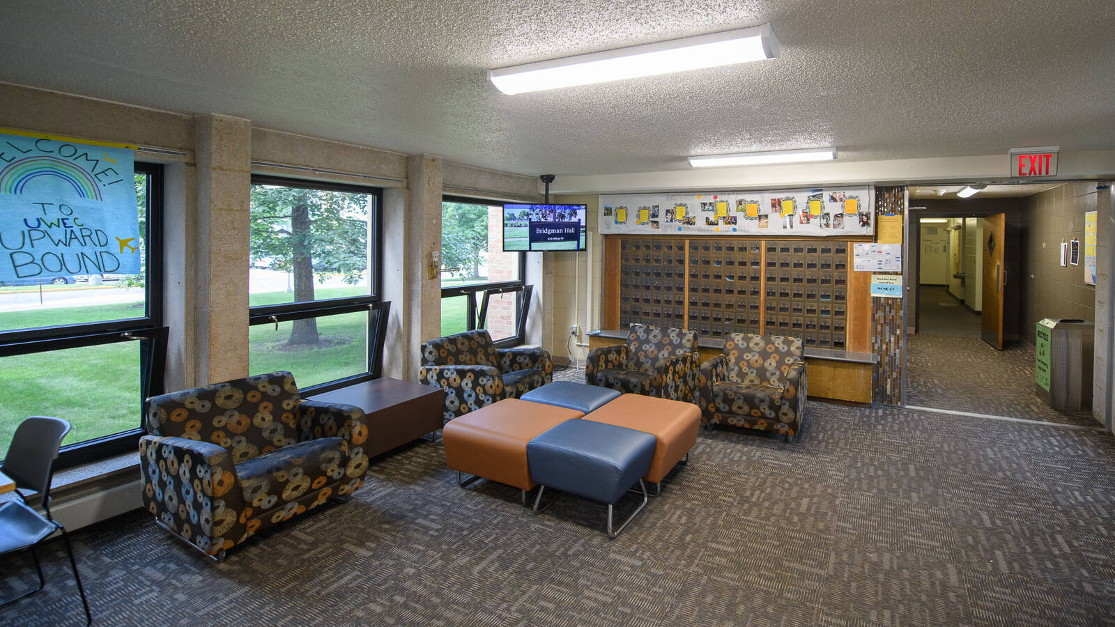 Lobby area in Bridgman Hall, complete with chairs for lounging and mailboxes.