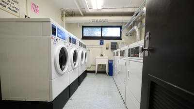 Laundry machines in a laundry room.