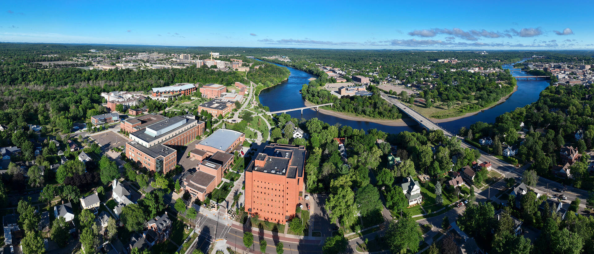 aerial campus shot with river bend