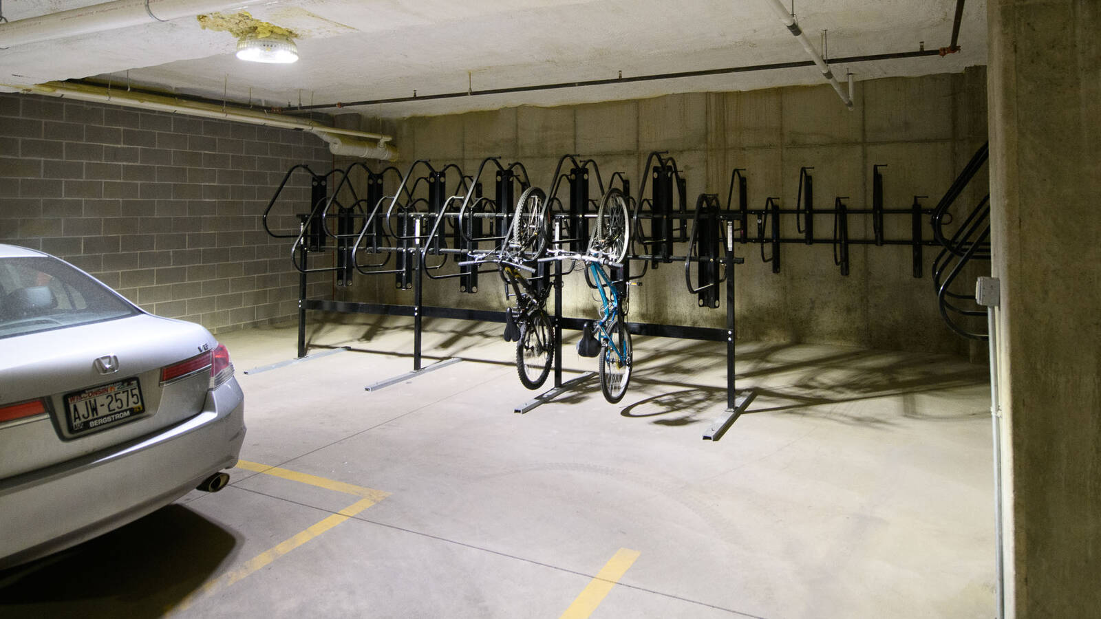 Underground parking garage with hanging bike parking.