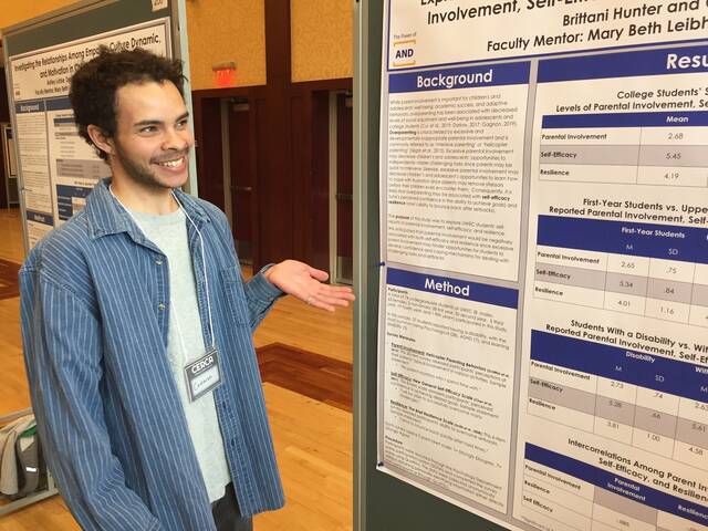 Cameron Merline presenting Research