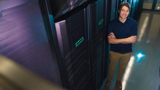 Tyler Bauer in the supercomputer cluster at CVTC