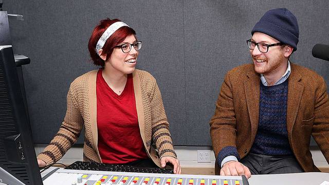 Students Breane Lyga and Glen Olson working in Blugold Radio station