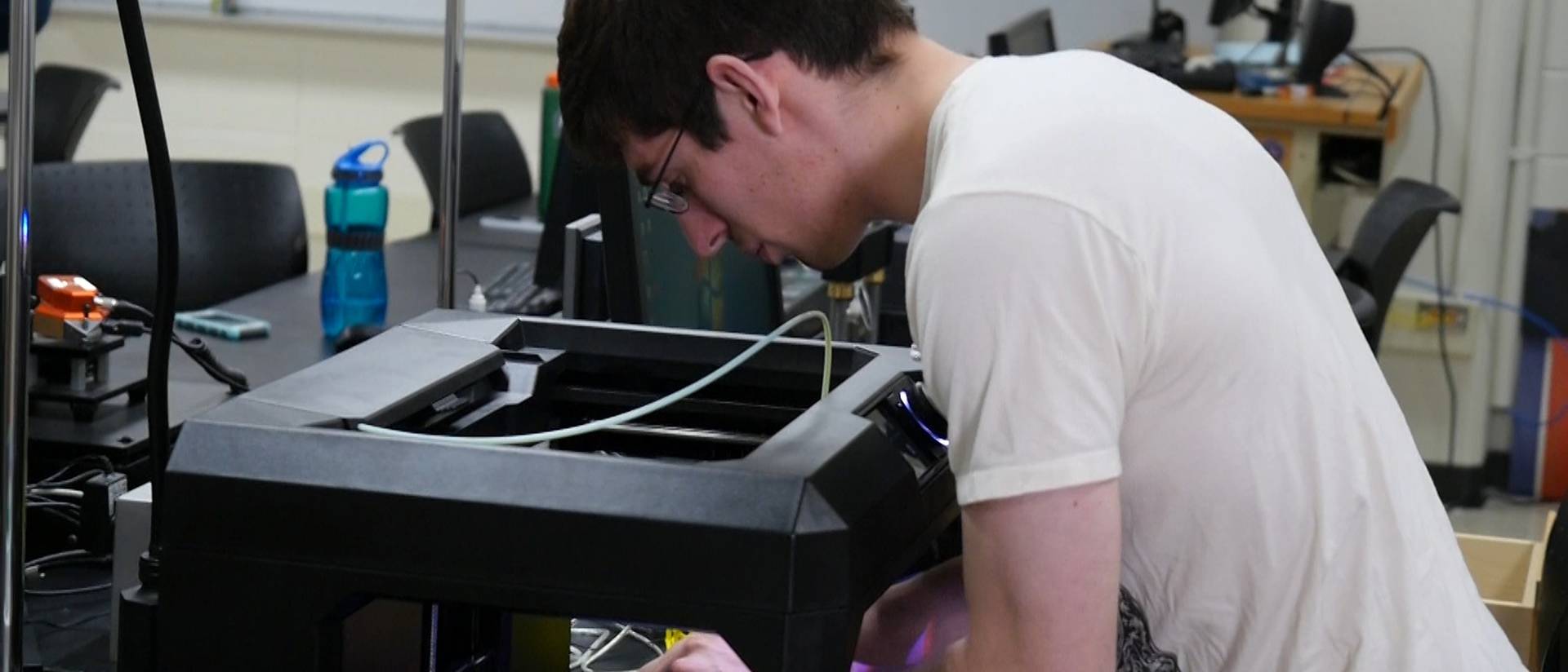 Gavriel Deprenger-Gottfried works with the 3-D printer, one of the many state-of-the-art instruments found in UW-Eau Claire's Materials Science Center. 