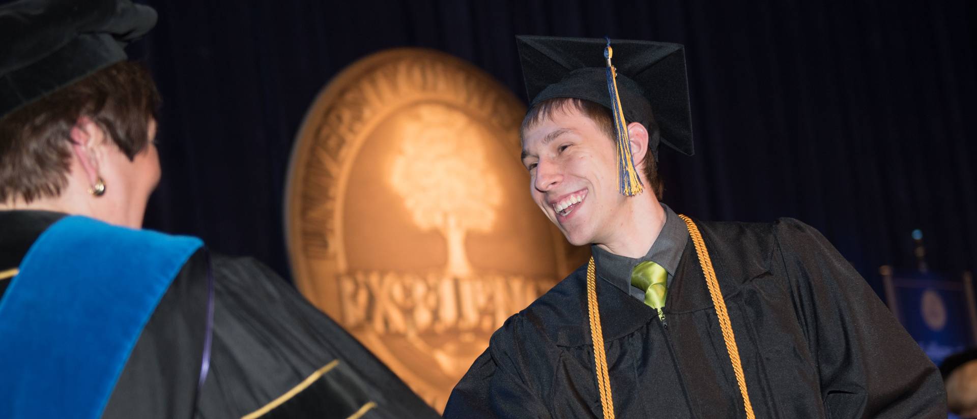 Grad receiving diploma