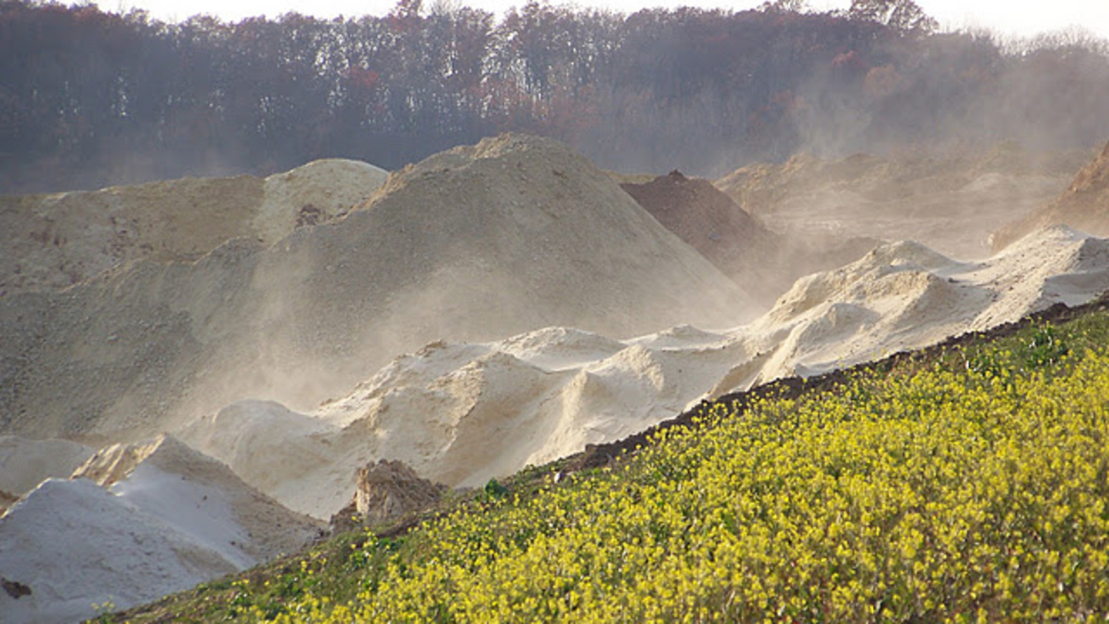 Sand blowing off of Silica Sand pile in Bloomer, WI