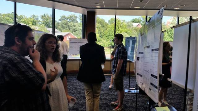 Students presenting research at a conference