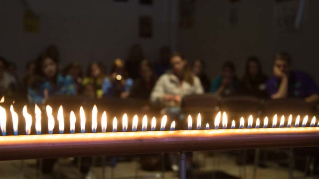 Students watch a fire experiment on Math