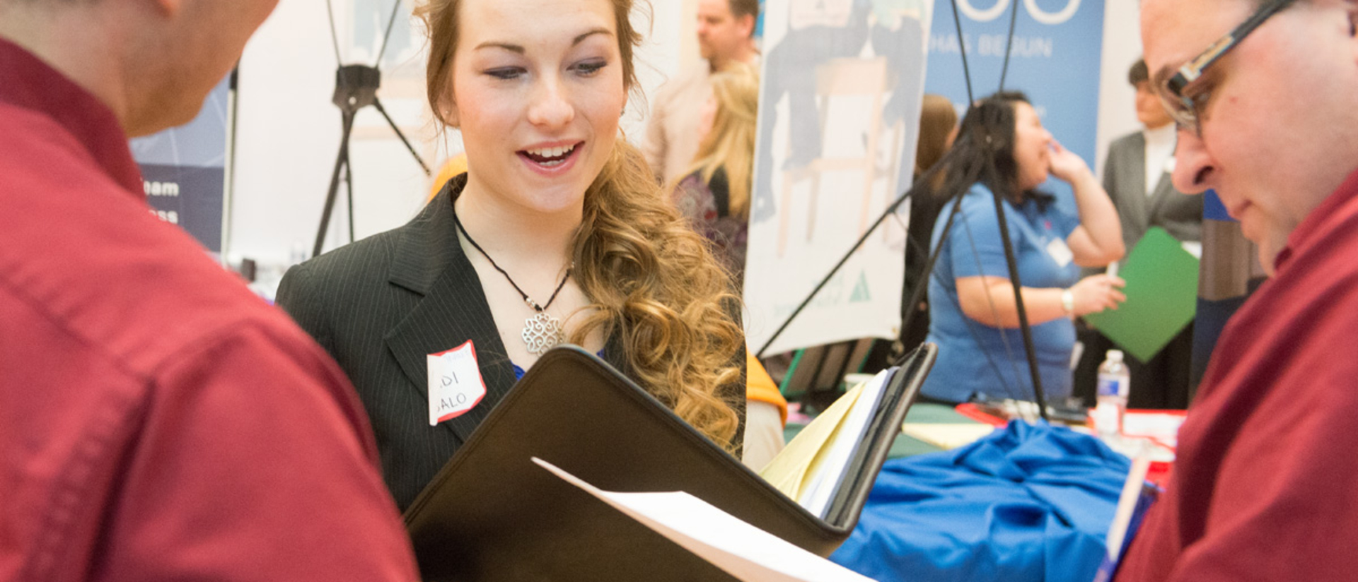 A student talking to recruiters at Career Conference