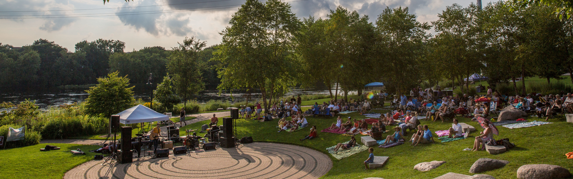 Music lovers in Eau Claire enjoying the Sounds Like Summer Concert Series in Phoenix Park.