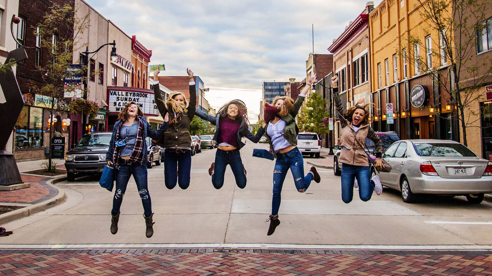 Blugolds jumping in street downtown for UW meets EC