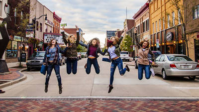 Blugolds jumping in street downtown for UW meets EC