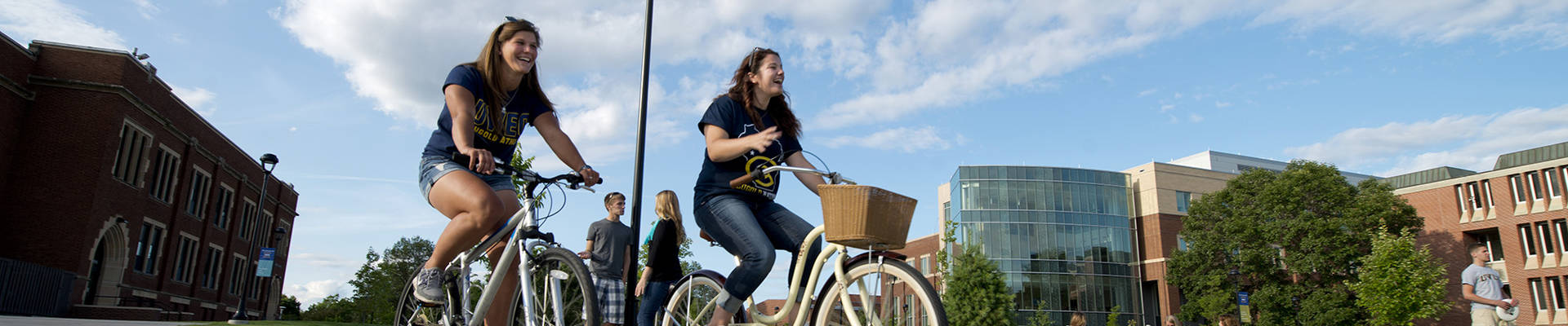 Students riding their bikes on campus.
