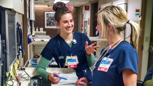 Two nursing students chatting with one another