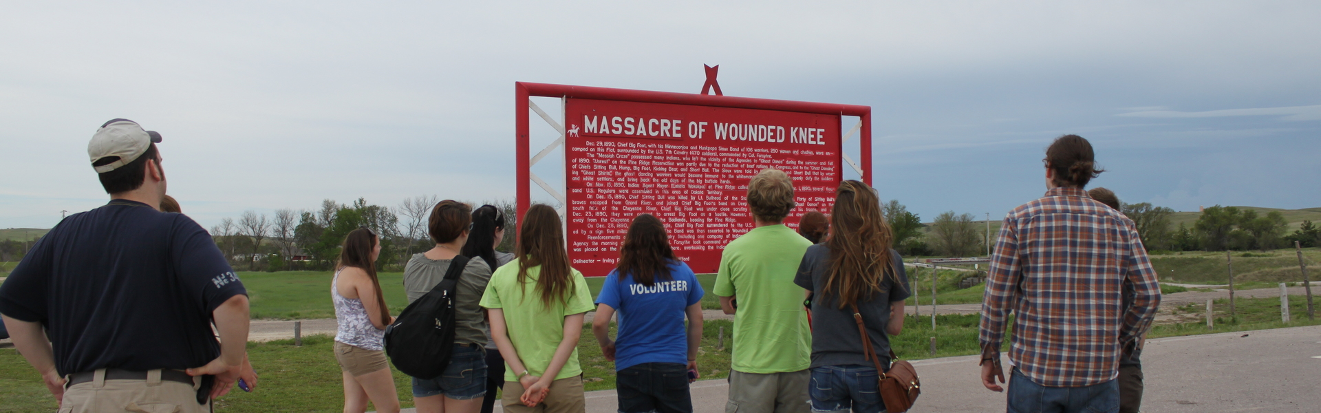 Students on the Pine Ridge immersion trip at the Wounded Knee Memorial