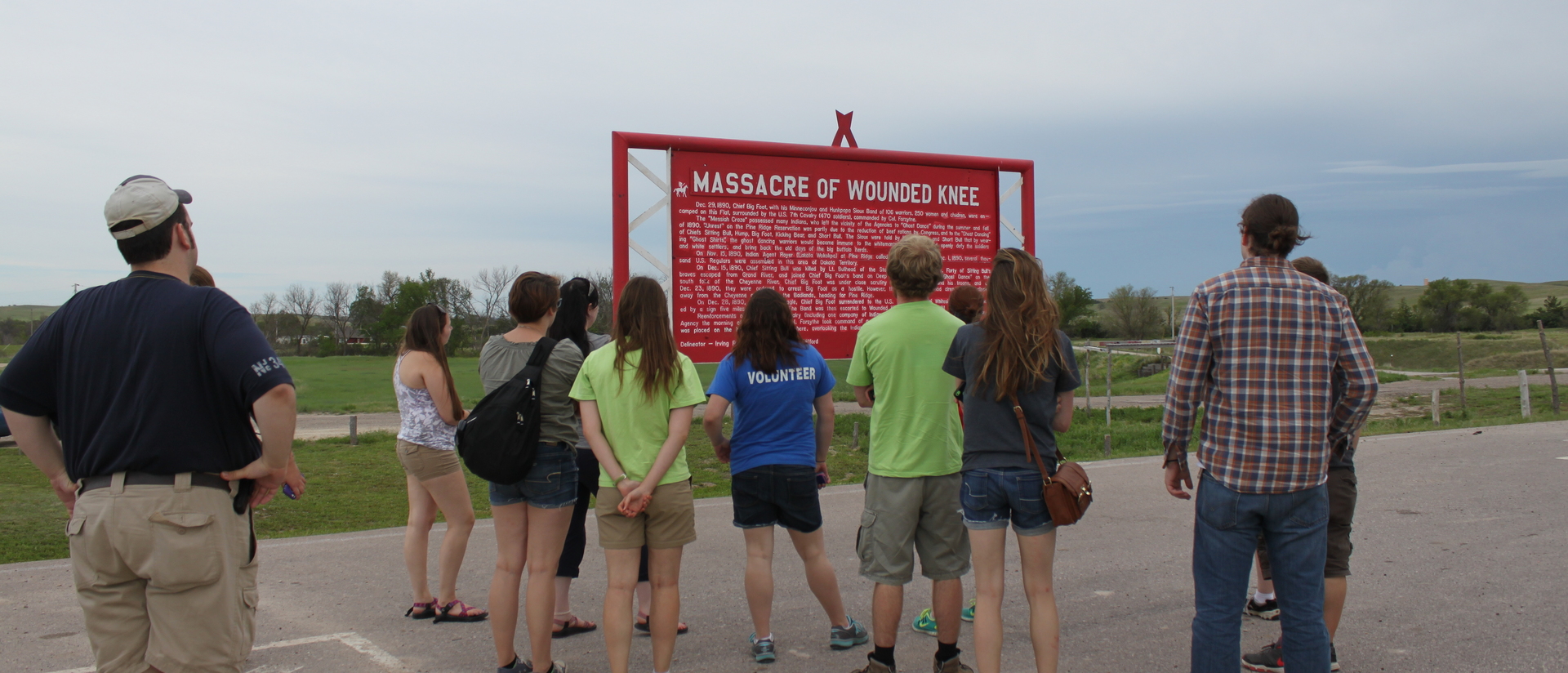 Students on the Pine Ridge immersion trip at the Wounded Knee Memorial