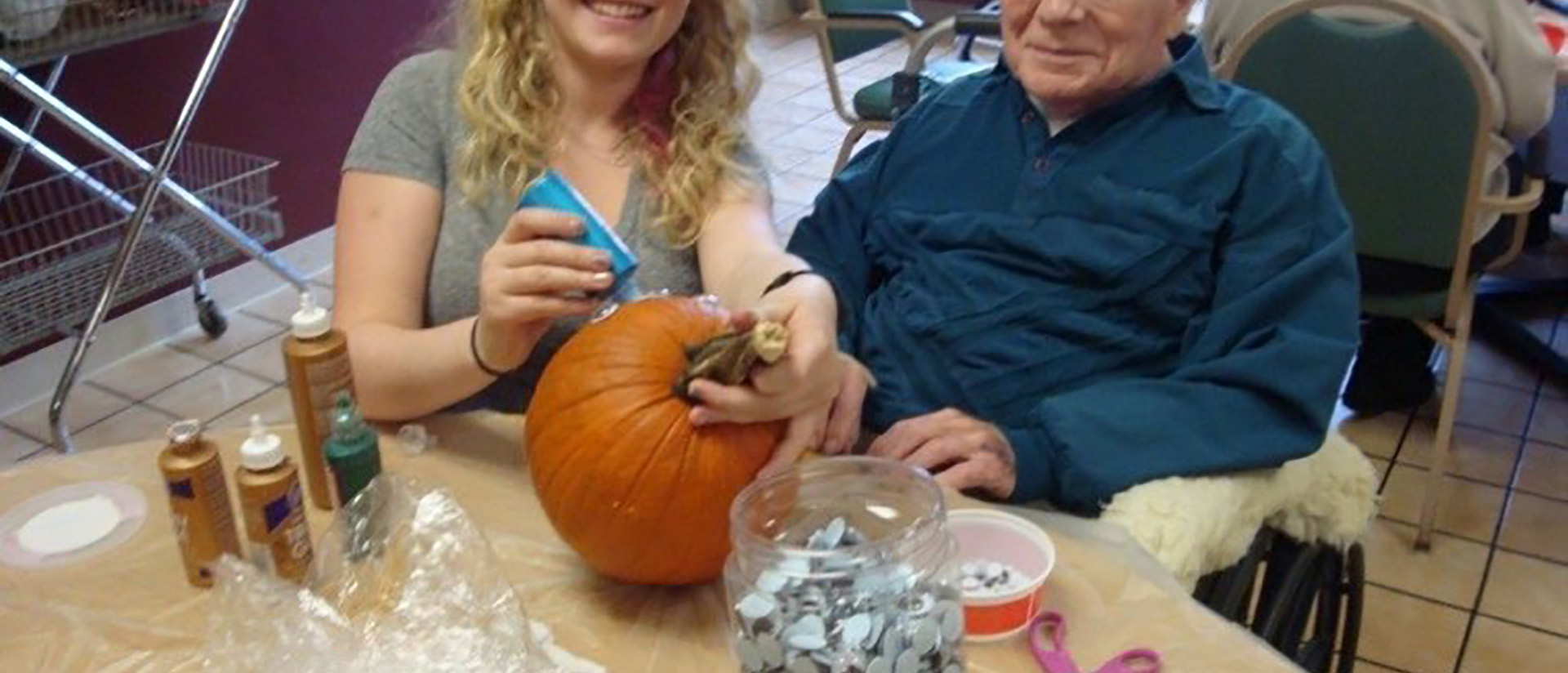 CHAASE practicum student volunteering with pumpkin carving